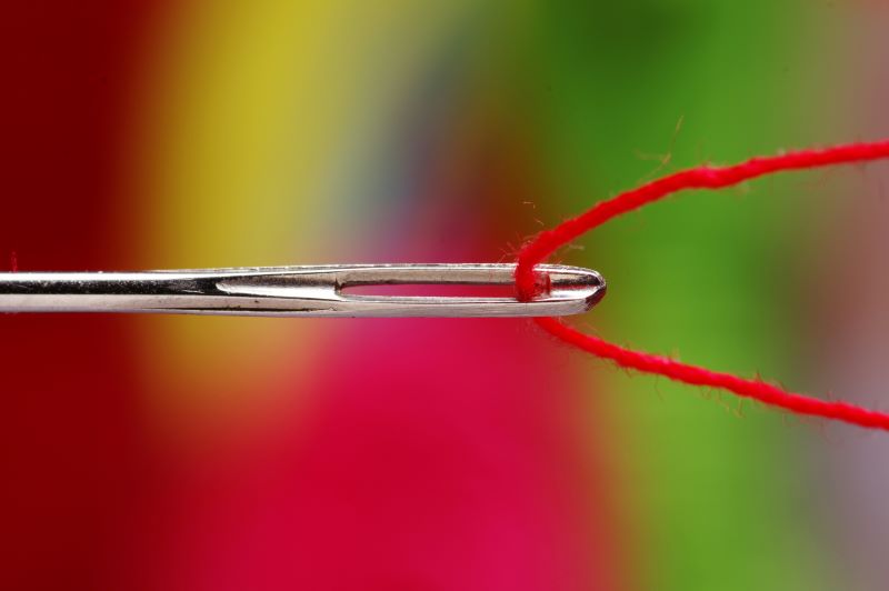 Needle being threaded